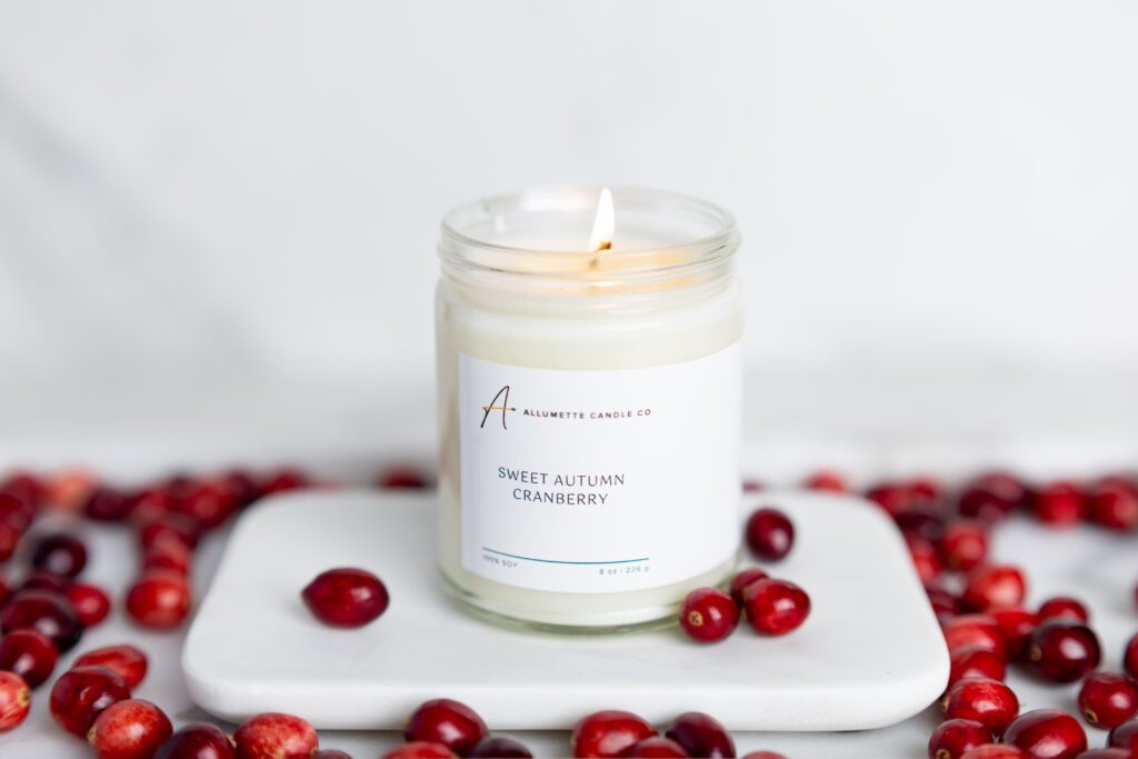 Lit cranberry scented candle
