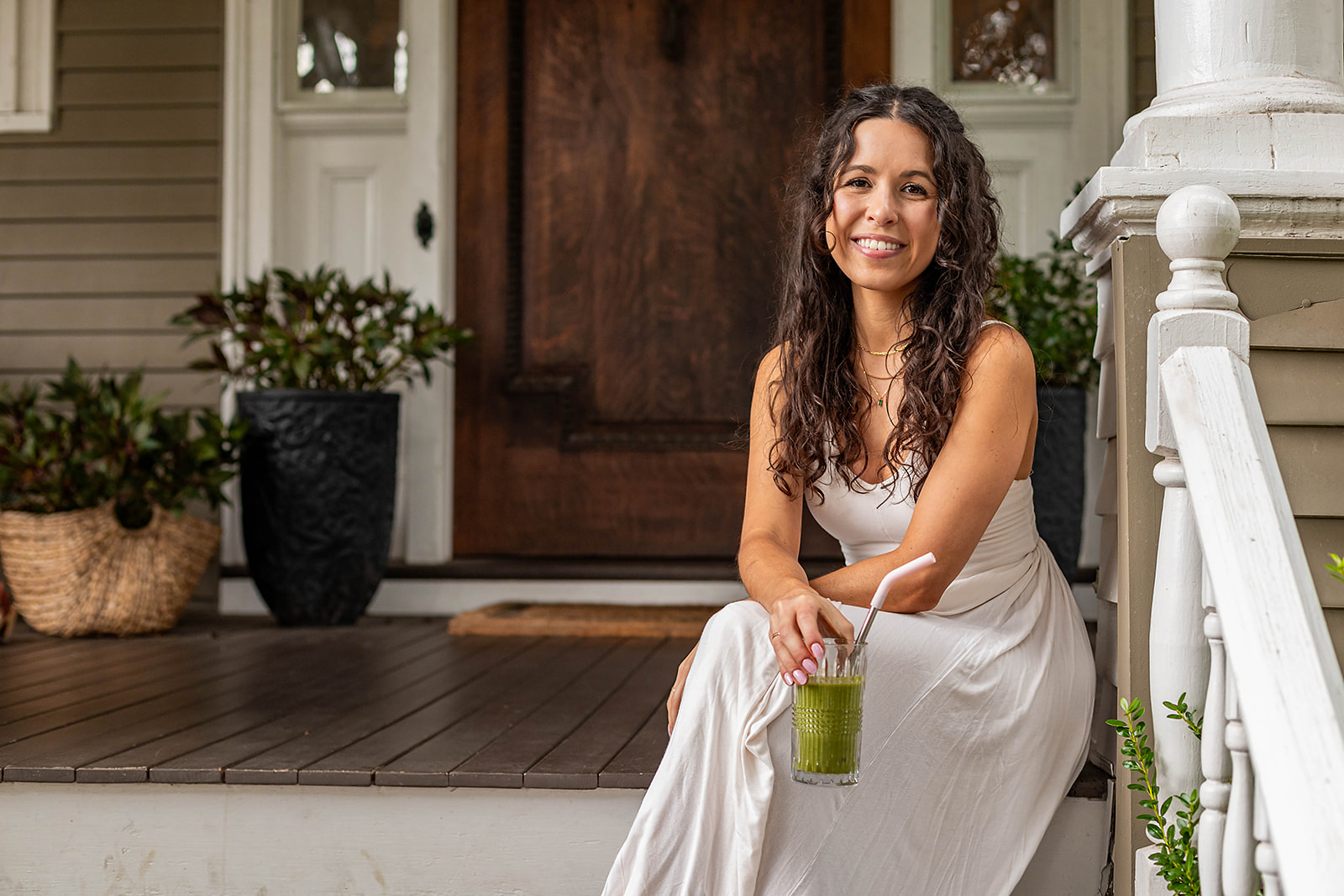 branding photography picture of a wellness coach drinking a healthy green smoothie