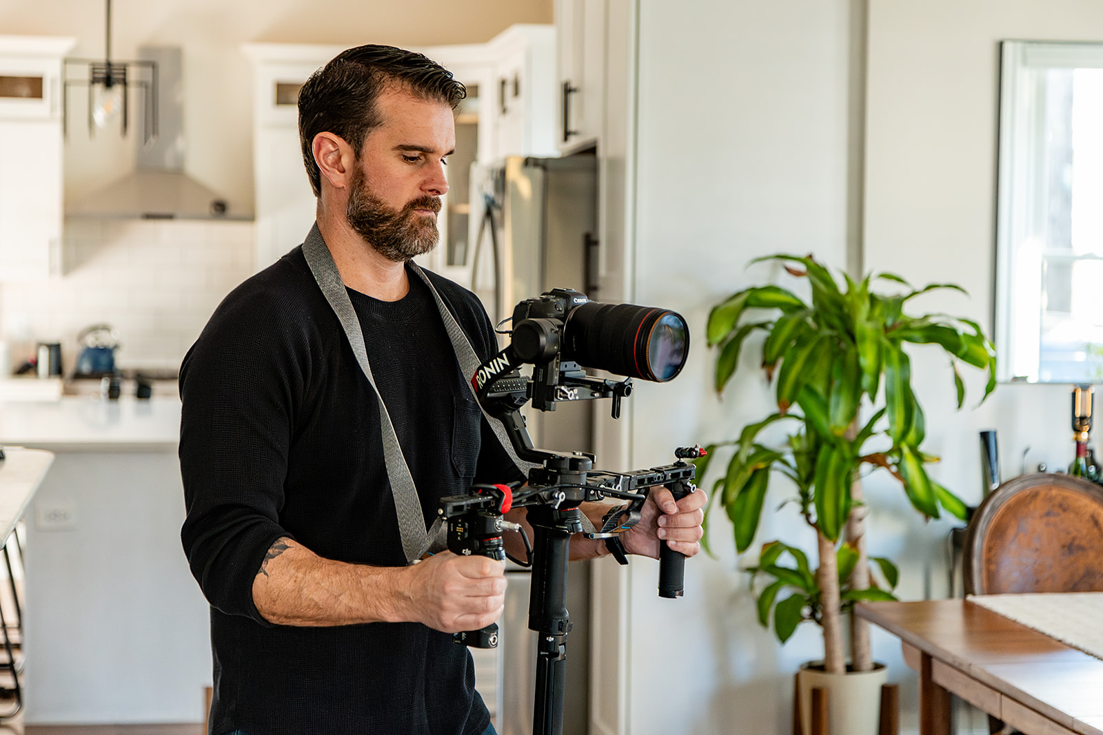 videographer using stabilizer to capture real estate video. 