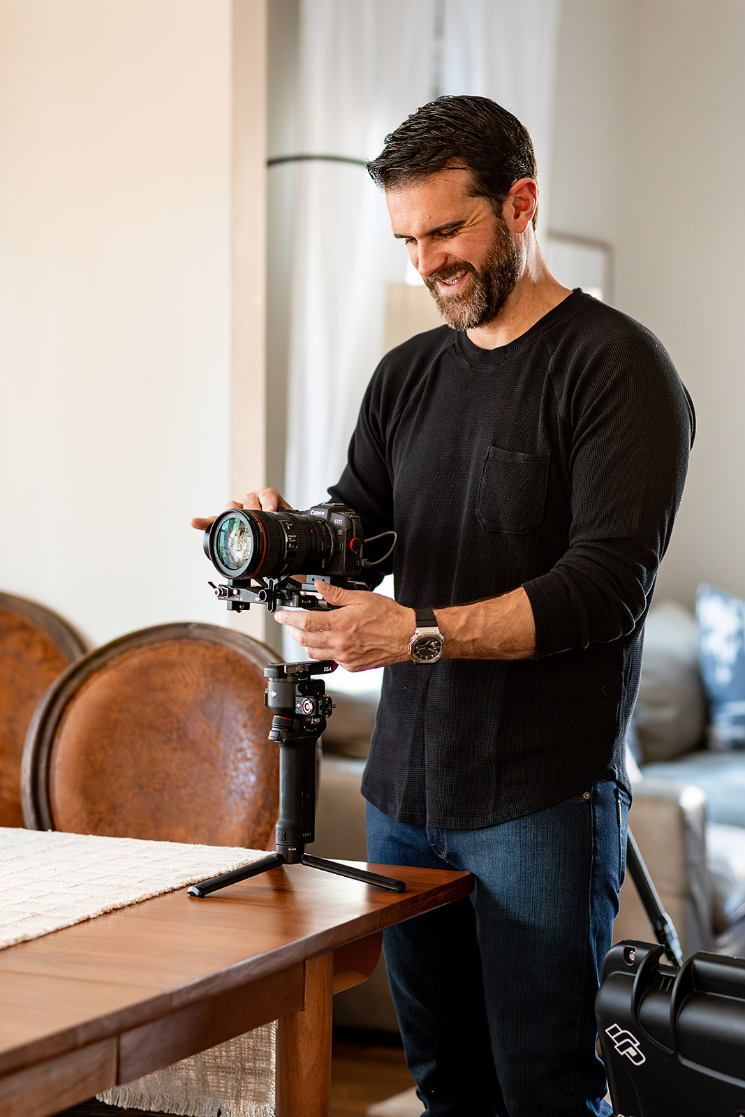 videographer setting up camera on a stabilizer. 